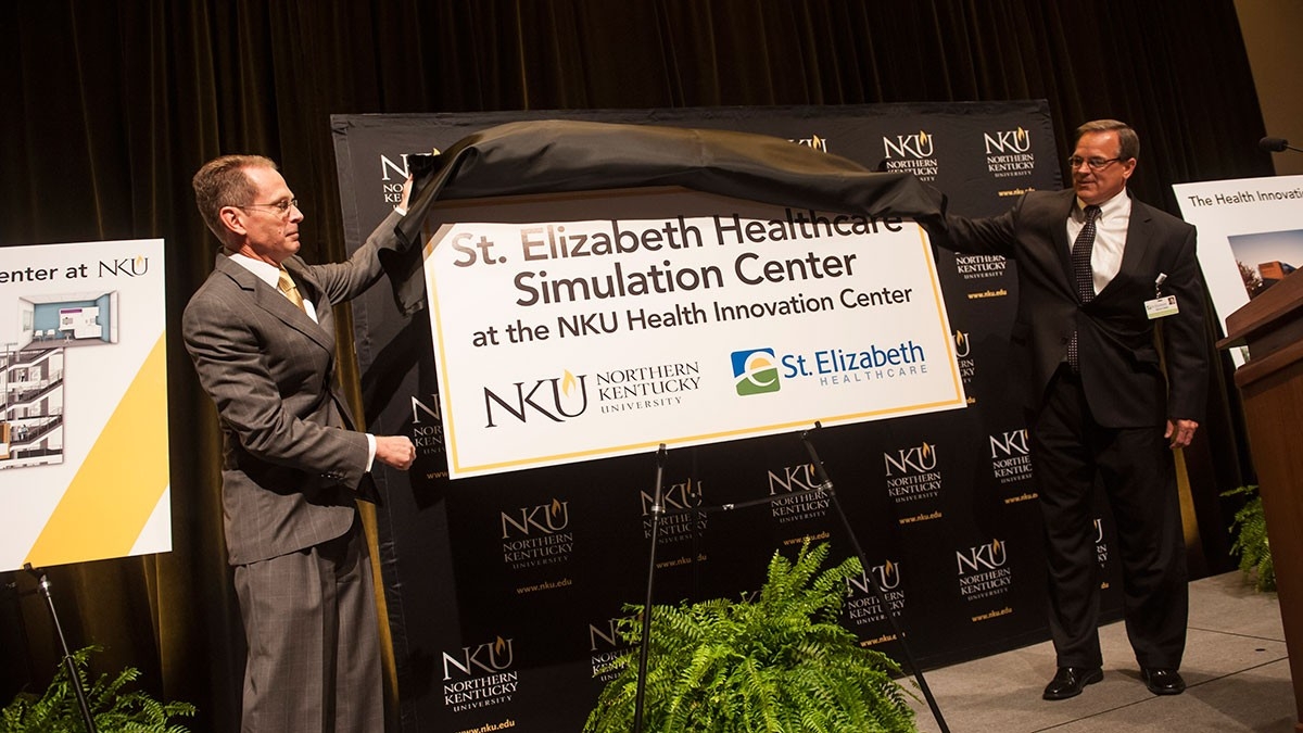 President Mearns dedicating St. E's healthcare stimulation center