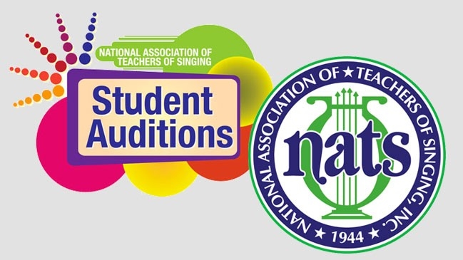 Librarian and student in the library at one of the computer terminals.