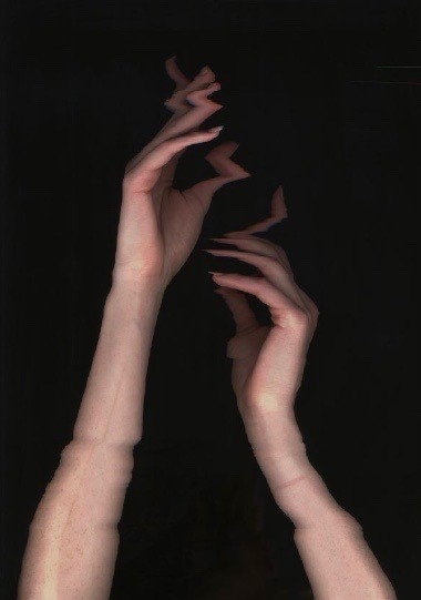 Hands against dark background