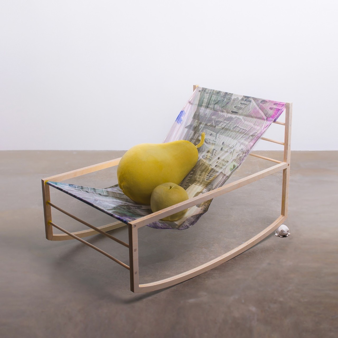 pear sitting in chair