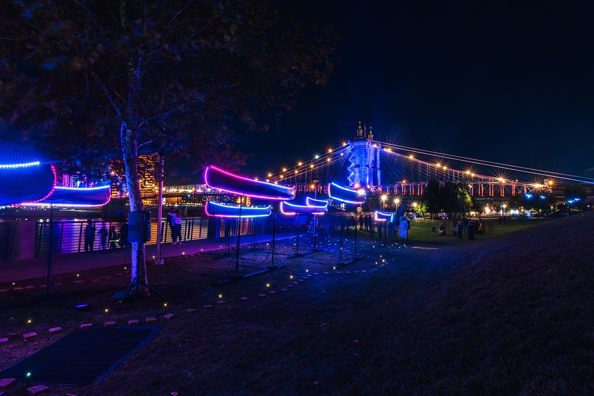 Light Installation - colored lights outlining canoes