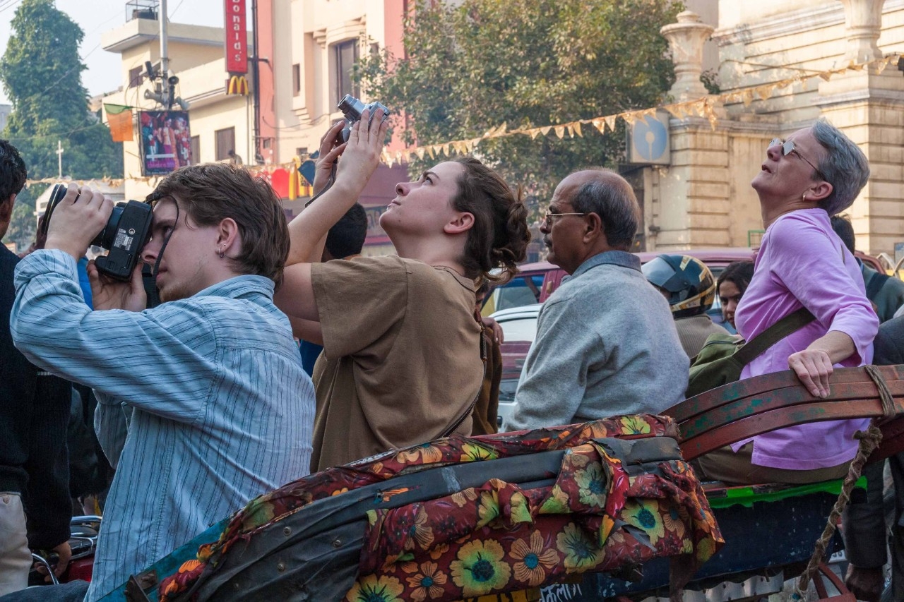 Students taking photos in the city