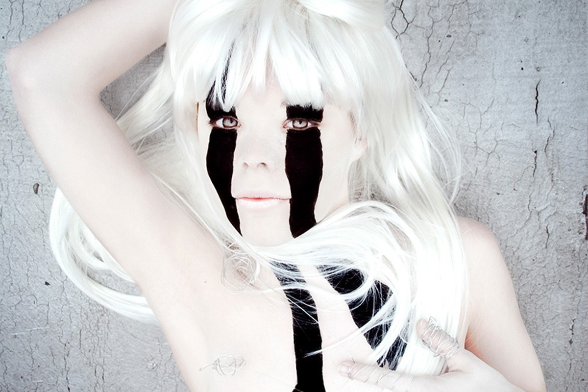 white hair young woman with black stripe eyes