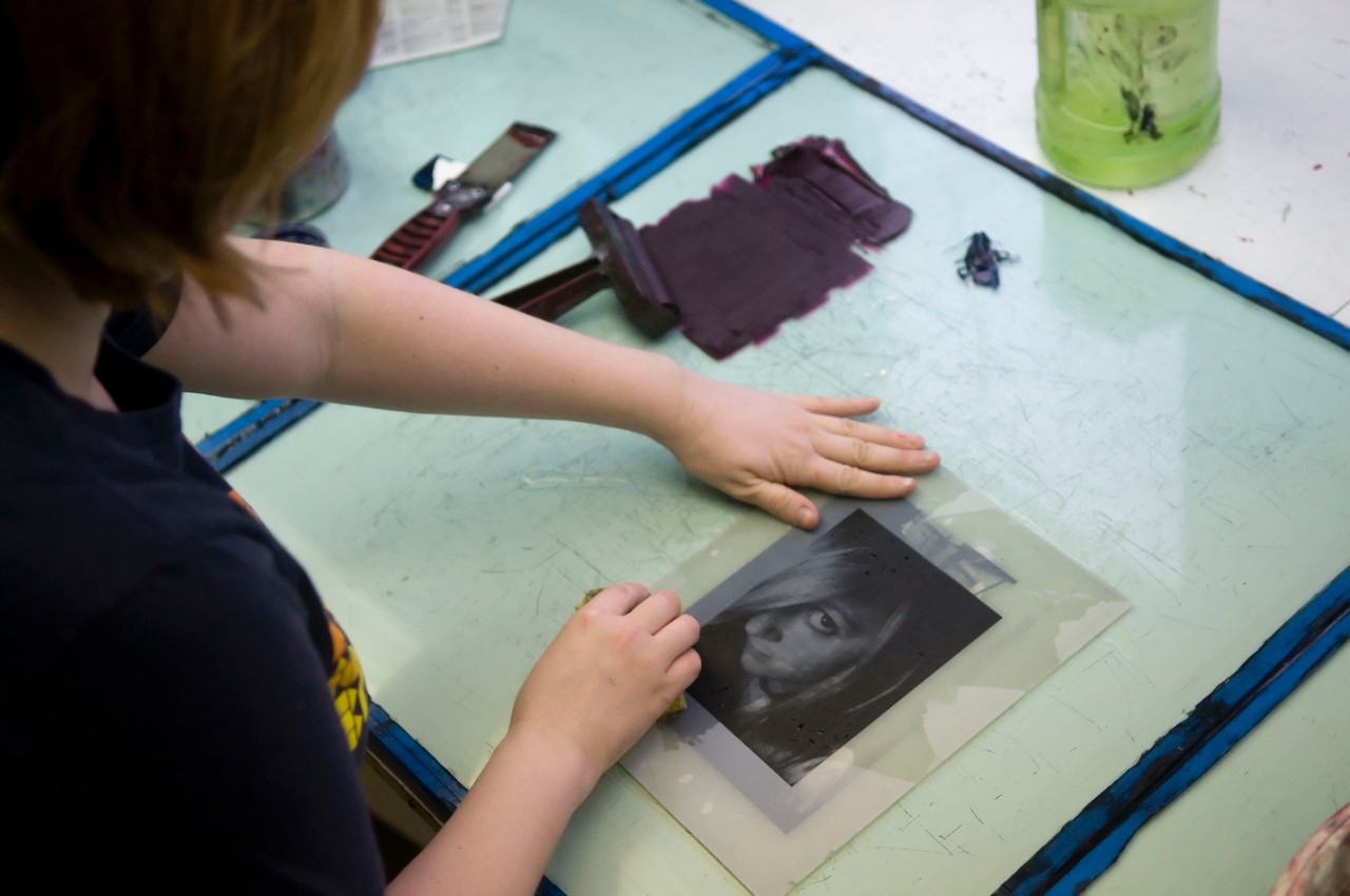 student printing a portrait of a girl with bangs