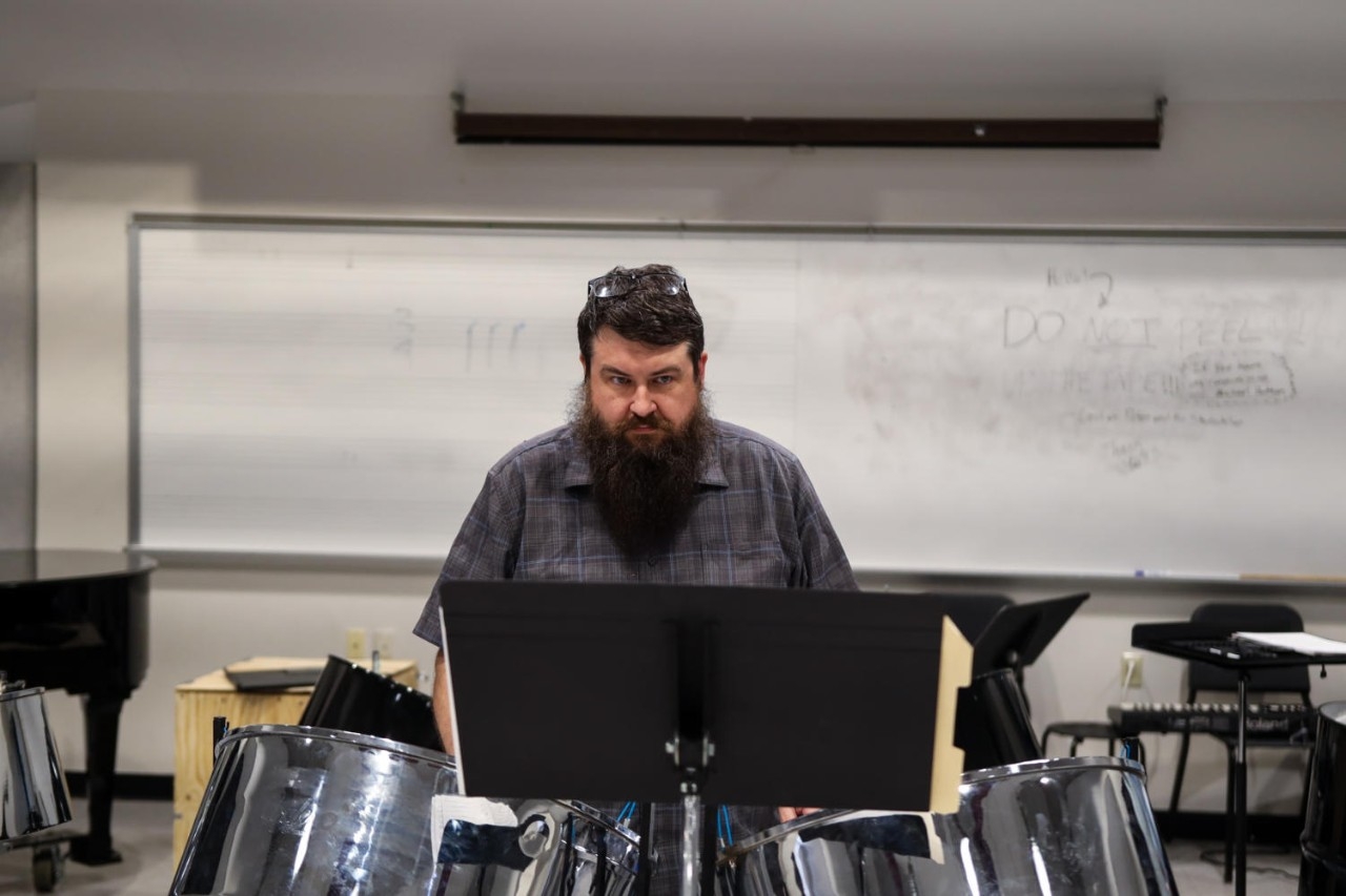 Cello players sitting together