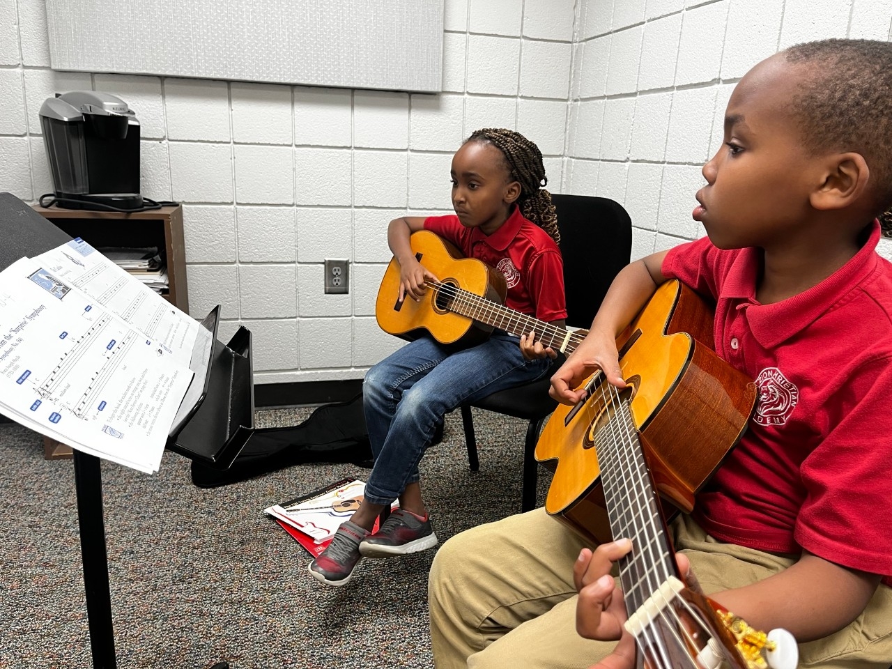 Cello players sitting together