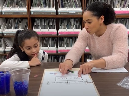 A math teacher uses unique techniques to teach math concepts to a young student