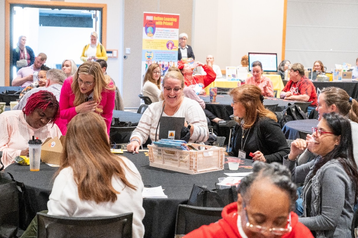 Attendees smile and laugh at the Tri-State STEM+Conference