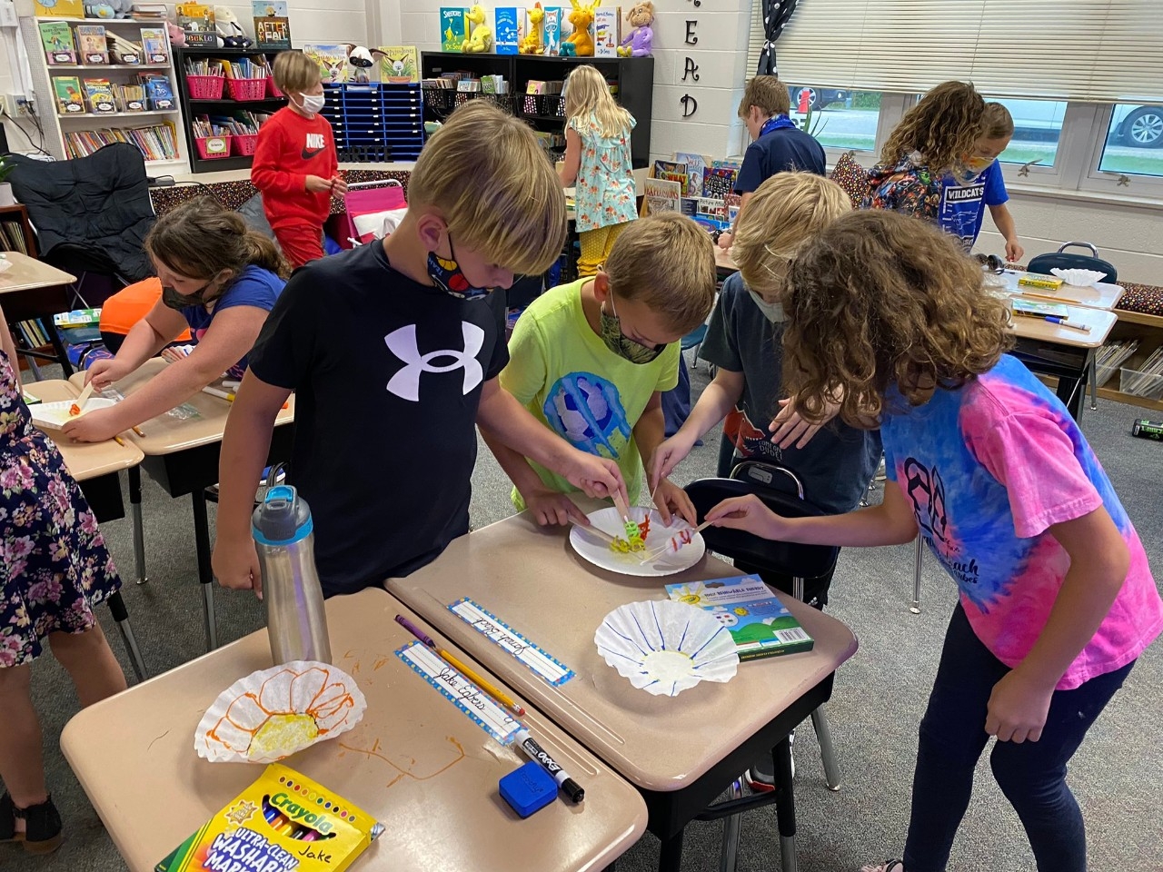 Elementary students doing hands on STEM2U lessons in their classroom.