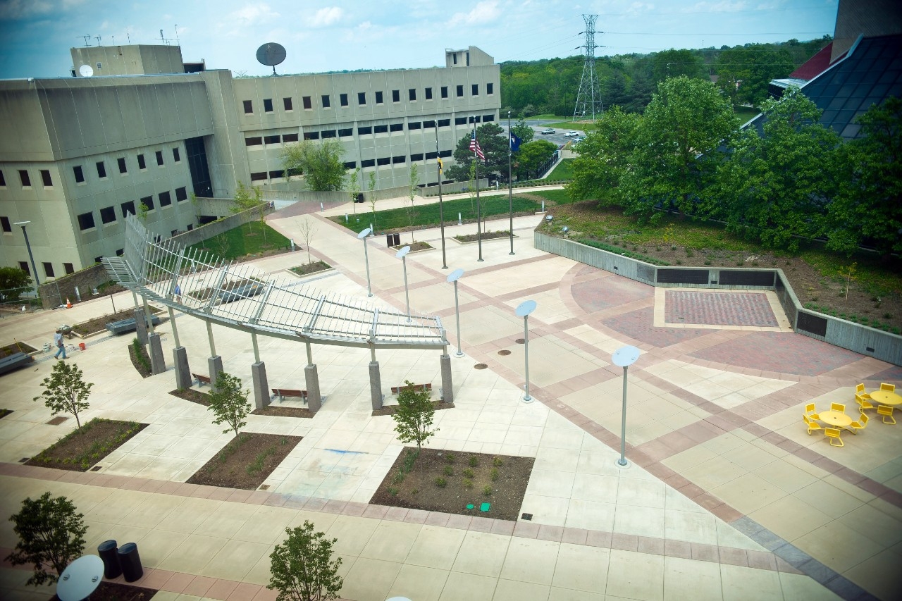 The exterior of NKU's Landrum Academic Center, surrounded by beautiful greenery on a sunny day