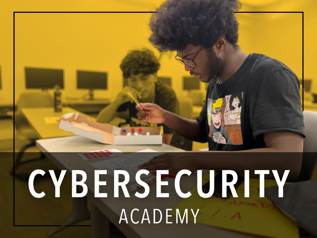 Two high school students doing a hands on simulation of cybersecurity protection planning