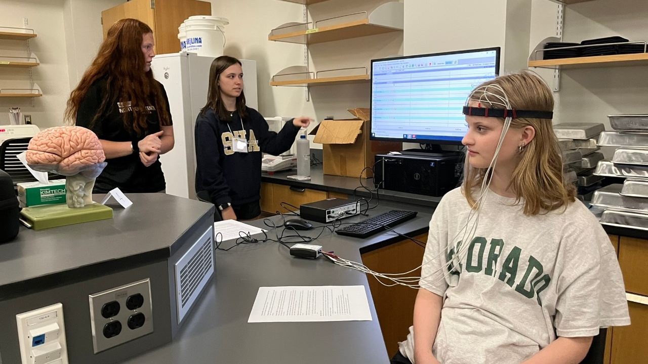 Students wear and test out EEG equipment, analyzing their data in Northern Kentucky University's neuroscience research lab. 