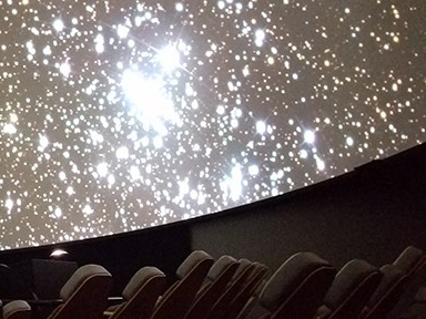 Planetarium presentation showcasing a cluster of stars.