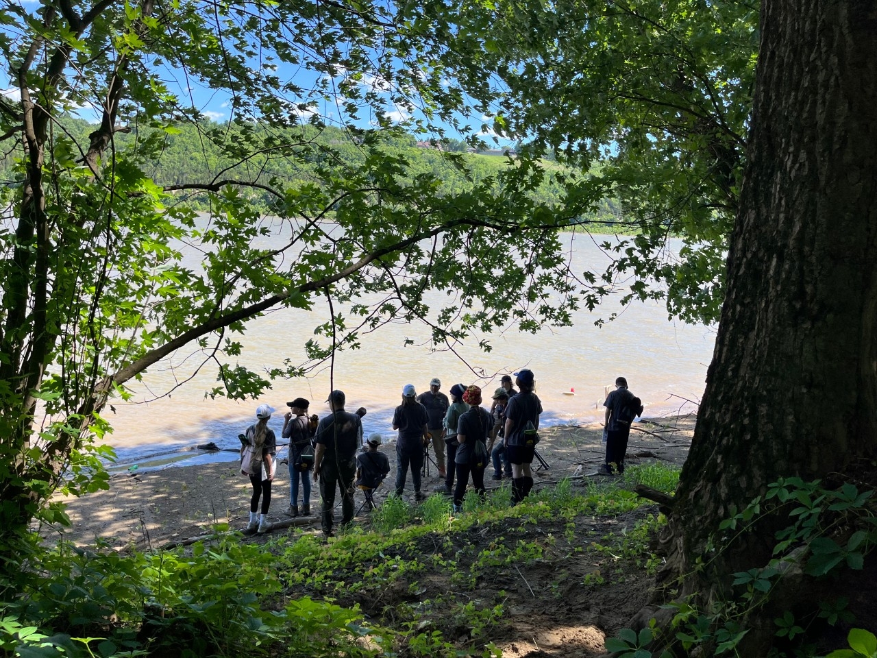 NKU REFS visitors emerge from the woods to view the banks of the Ohio River.