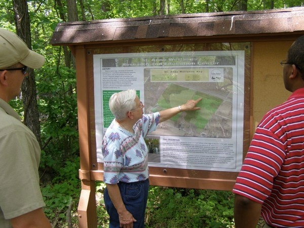 Sister Mary Jo at the main kiosk of St. Anne Woods and Wetlands.