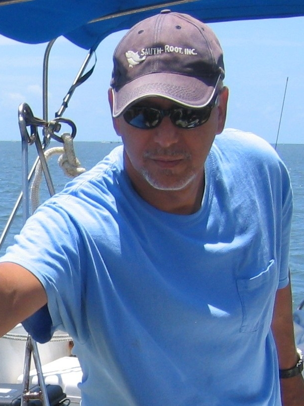 Dr. Acosta at sea on a boat during research.