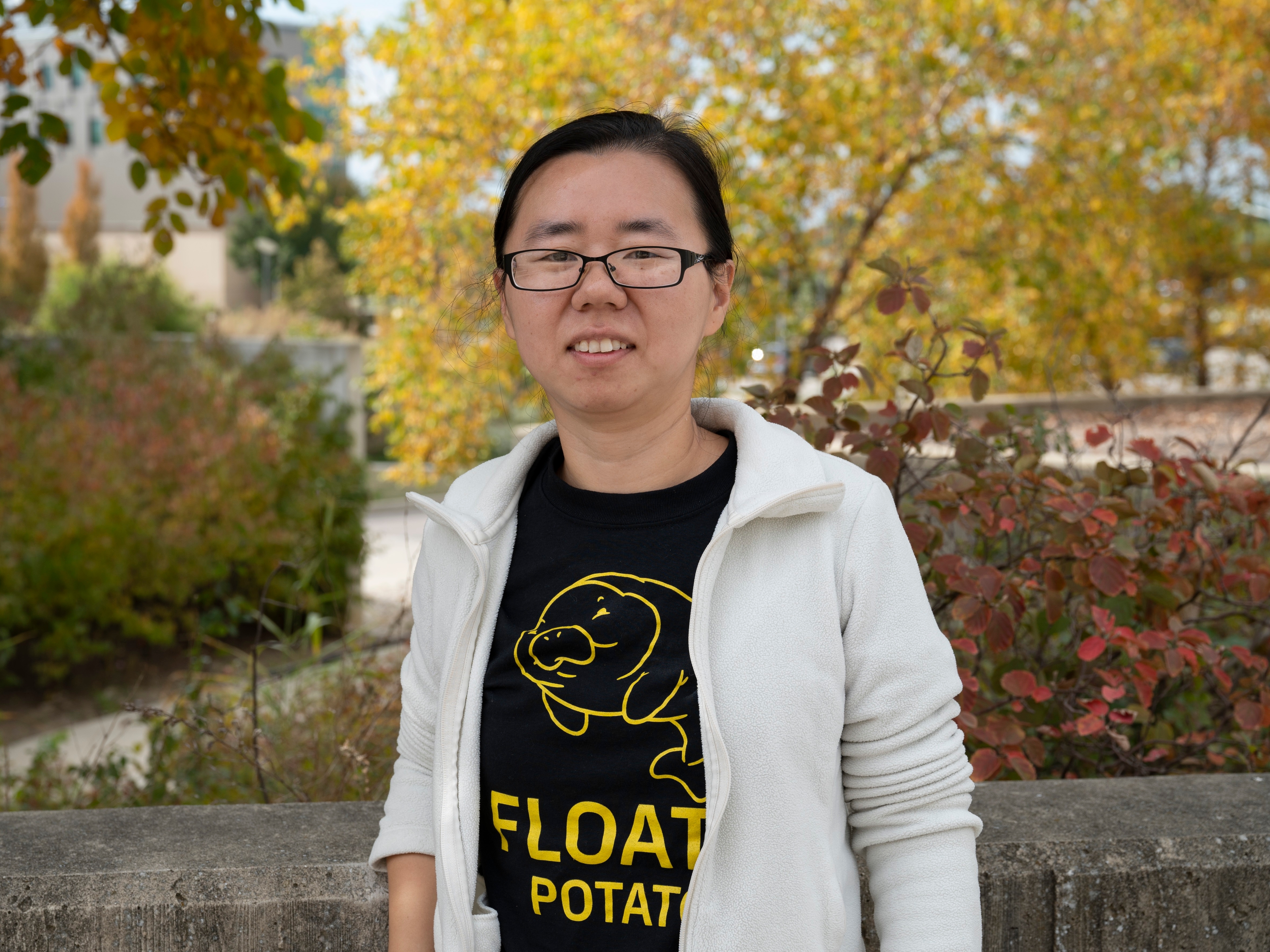 Photo of Dr. Xie taken outside, on the NKU campus, during the biology Olympics event.