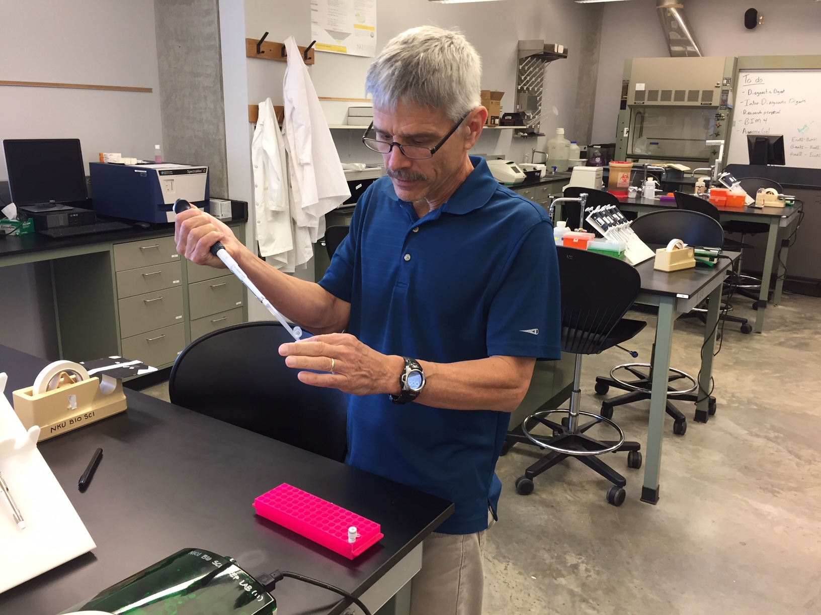 Photo of Dr. Schultheis working in one of the research labs on campus.