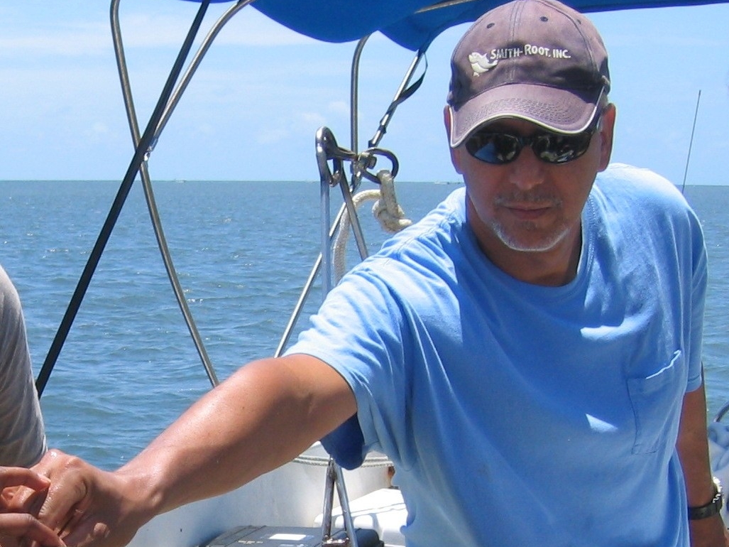 Dr. Acosta at sea on a boat during research.