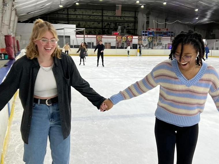 Nu Rho Psi members ice skating together