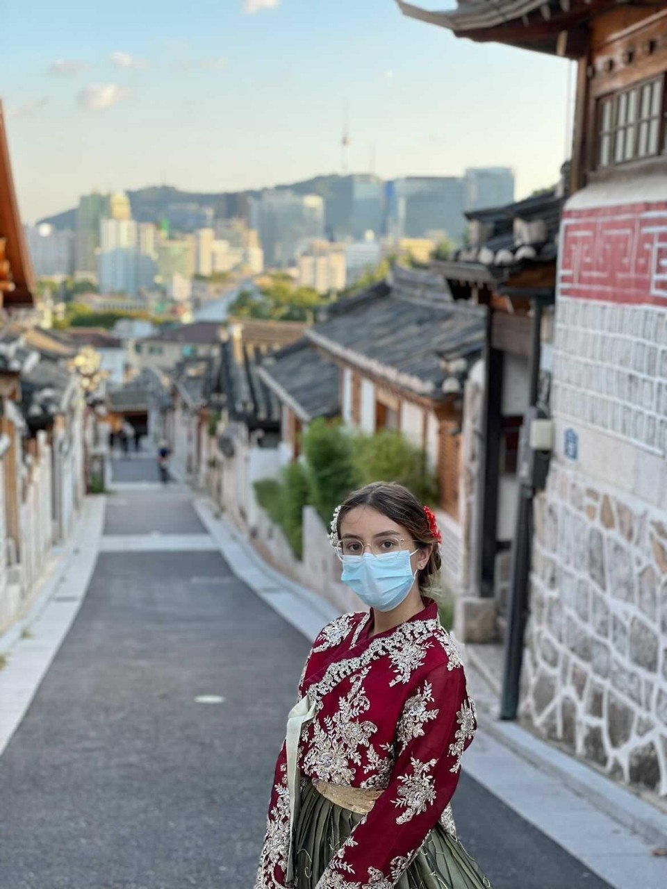 Student in traditional dress on Korean street