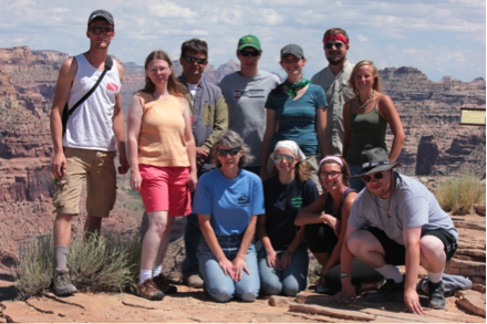 Paleontology students standing in the desert