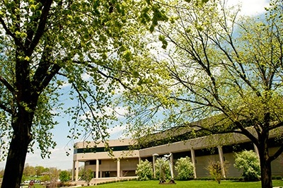 The exterior of NKU's Business Academic Center, surrounded by lovely greenery on a sunny day