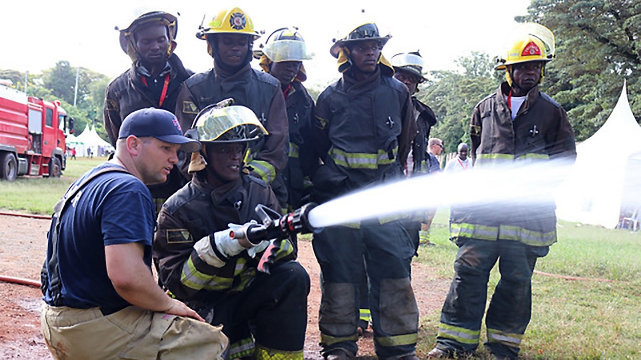 Firefighter with Africa Fire Mission training 7 firefighters in Malawi