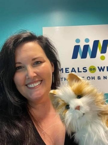 Jennifer Steele with a cat hand puppet