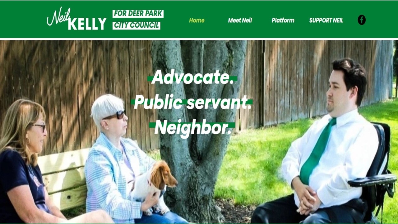 Neil Kelly speaking with two ladies on a bench