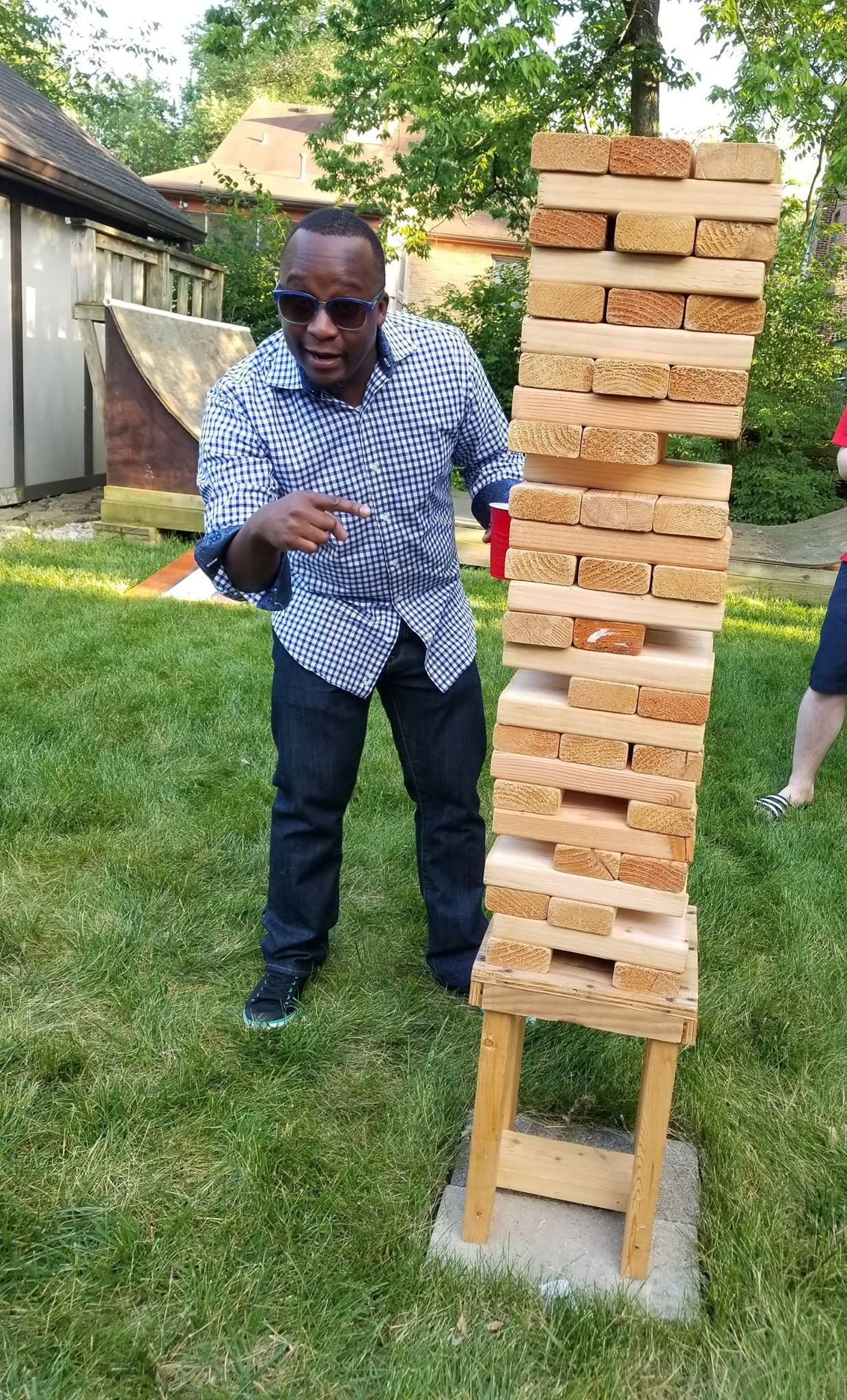 MPA alum Fitz Chibamu playing giant jenga
