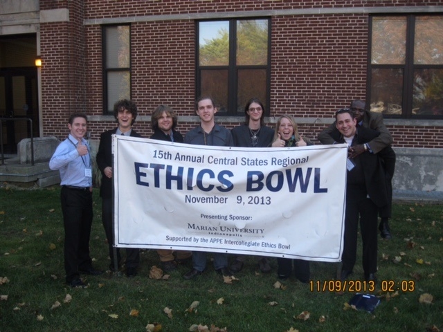 Image of Ethics Bowl Participants Holding Banner