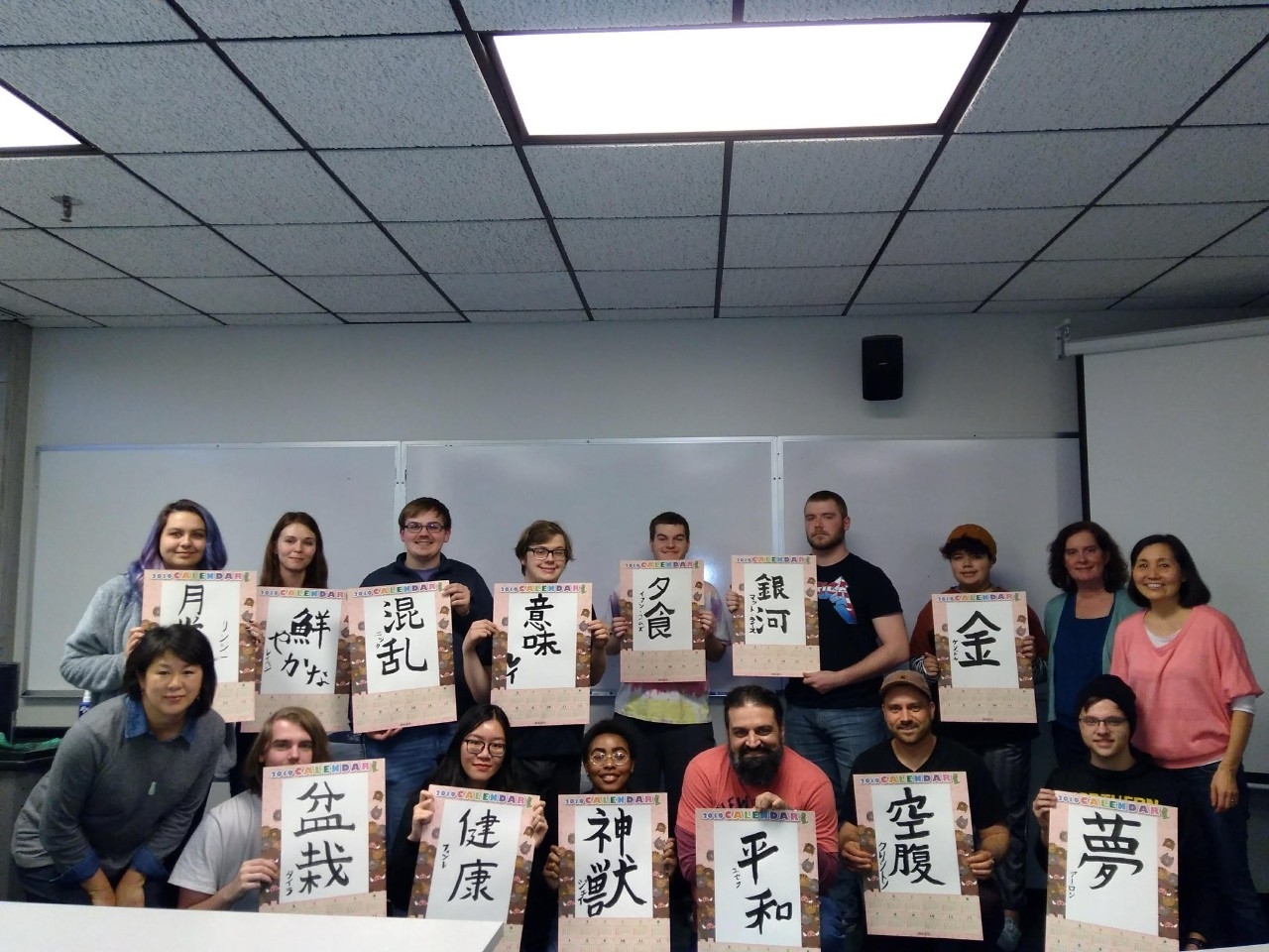 Students presenting japanese calligraphy 