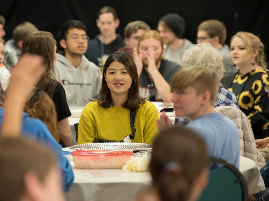 Students dining at a sushi event
