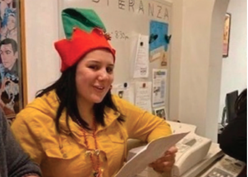Student wearing a holiday hat.