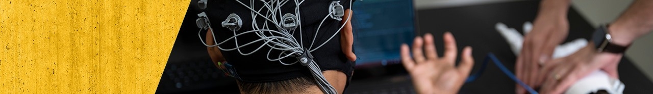 Student wearing a cap hooked up with wires.
