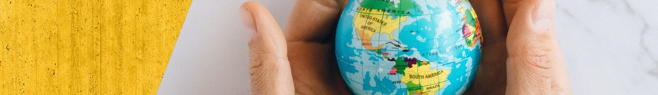 Picture of hands holding a tiny globe