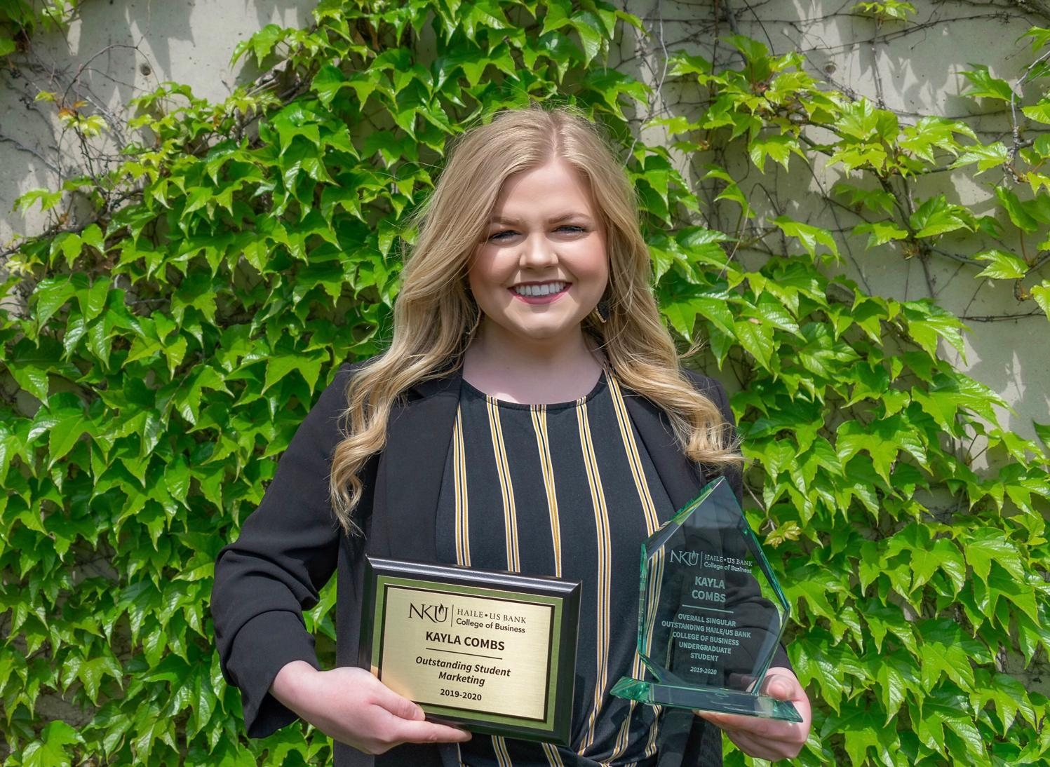 Kayla Combs with her Overall Outstanding Haile/US Bank College of Business Undergraduate Student Award