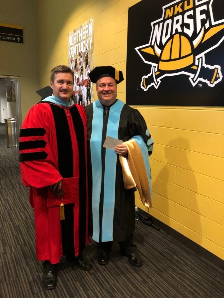Professor Jim Allen and EdD graduate in graduation robes