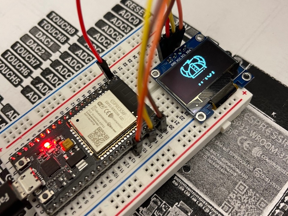 An ESP32 microcontroller is programmed to display the Norse IoT logo
