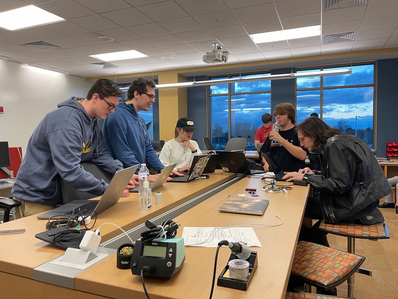 A photo of students working on IoT projects