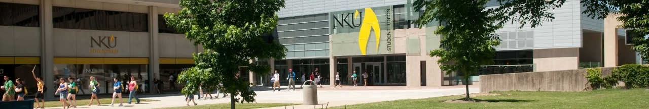 Students walking on campus in front of the Student Union building.
