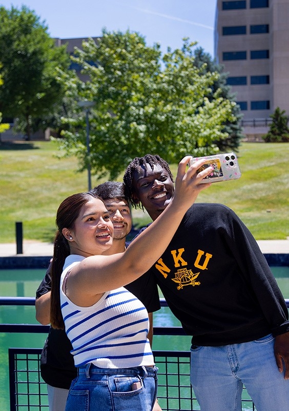 Life @ NKU: Students taking a selfie. Learn more about student life on campus, explore housing and major student organizations on campus