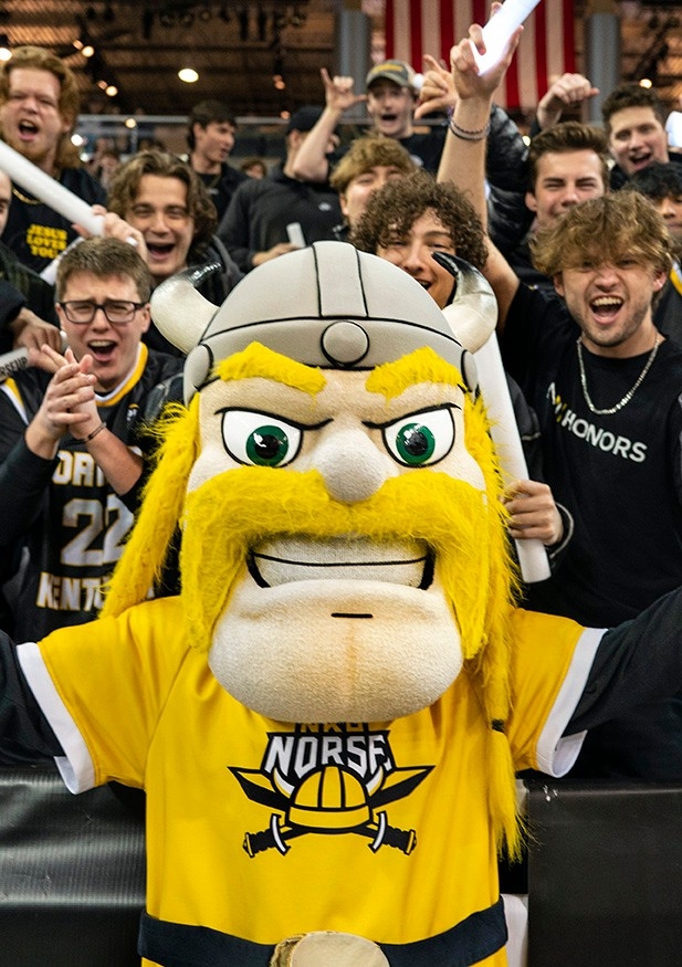 Student Engagement: Victor mascot cheering at an event