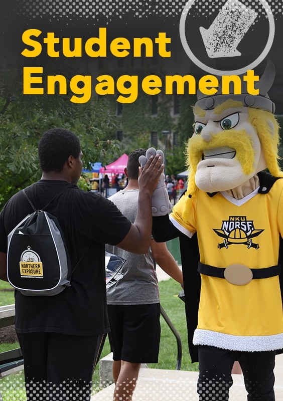 Student Engagement: Victor interacting with a student on campus