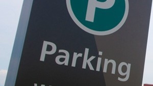 A close-up image of a parking sign