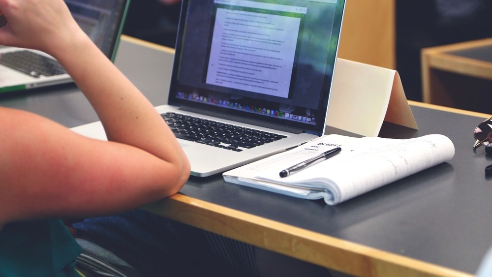 a close-up of a person using a laptop computer