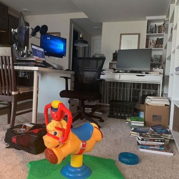 Humans of Greater Cincinnati - Introductory post image showing a workplace at home with a modest workstation and children's toys on the floor.