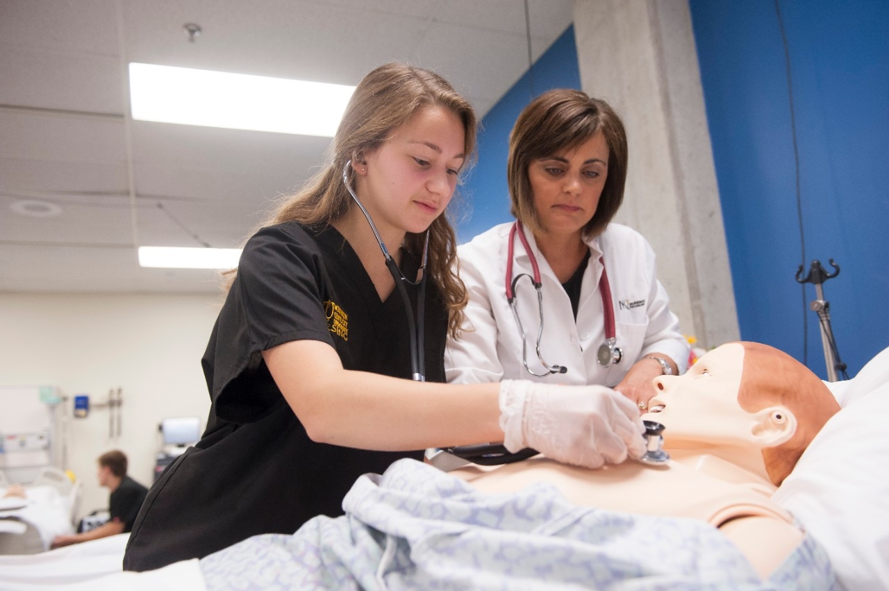 nursing student with faculty