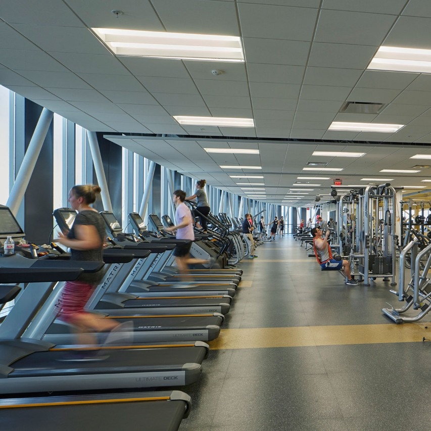 Close-up of a person's legs running on a treadmill.